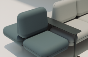 Detalle de banco modular con módulos verde azulado y crema y bandeja negra